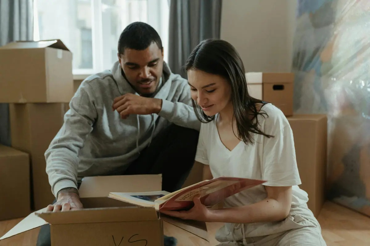 Couple reviewing documents while preparing to sell their home – home selling process and best way to sell a house