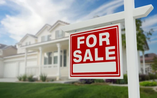 For sale sign in front of a home